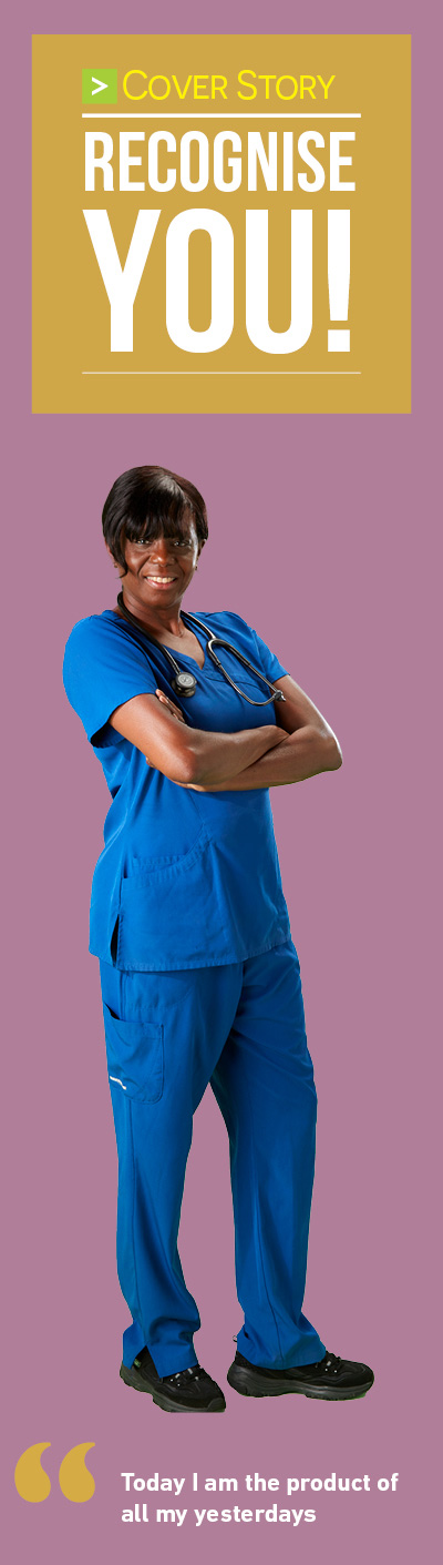 Nurse in blue scrubs isolated on a pink background