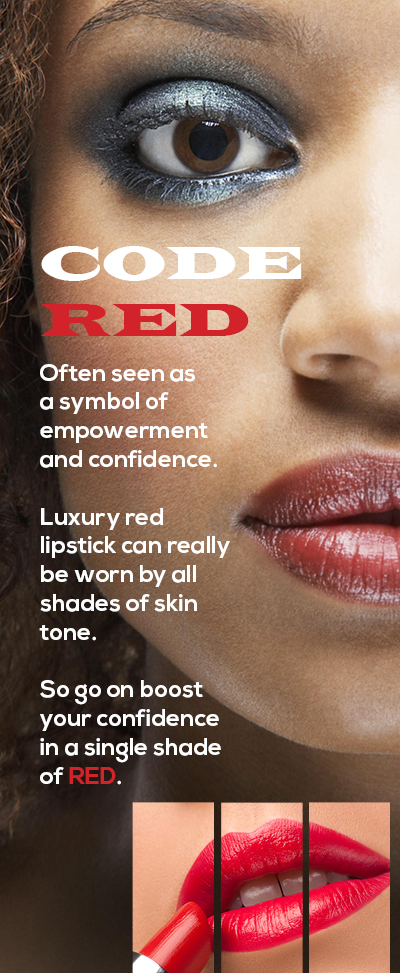 Close up of a beautiful young dark skinned woman's face with bright red lipstick