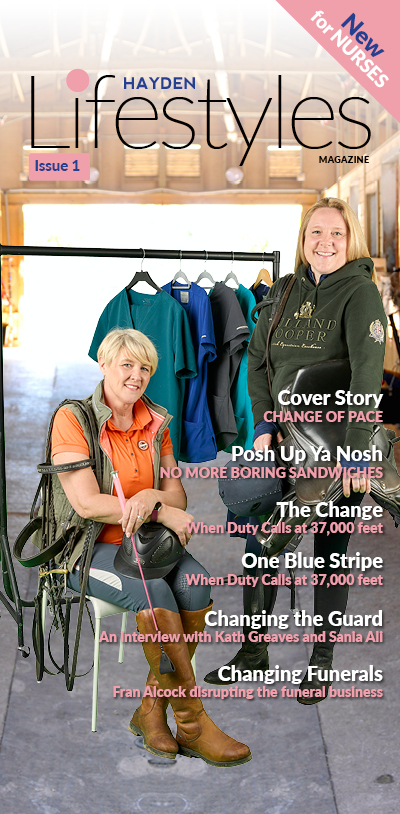 HAYDEN Lifestyles Magazine cover shot with 2 ladies in riding gear in a stable